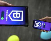 a person holding a cell phone in their hand